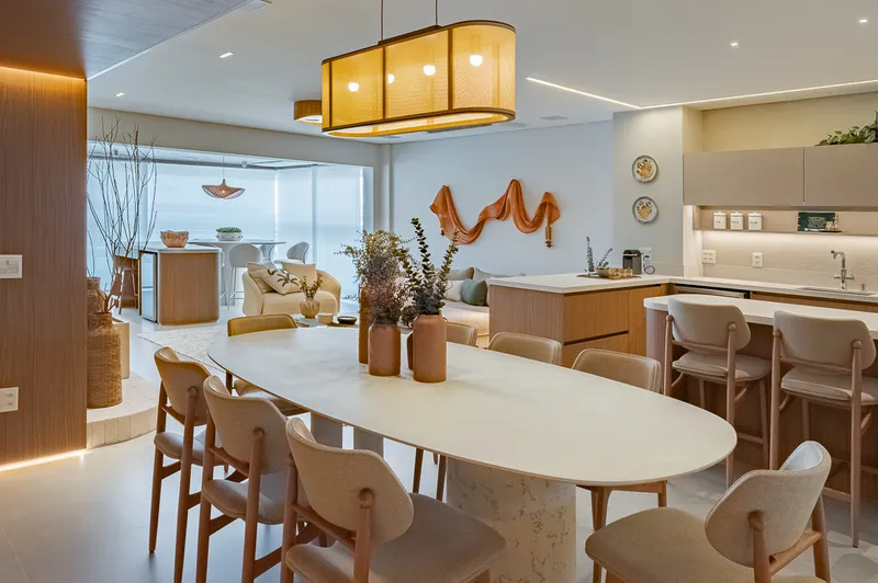 Sala de jantar integrada com cozinha e varanda — reforma apartamento alto padrão Baixada Santista